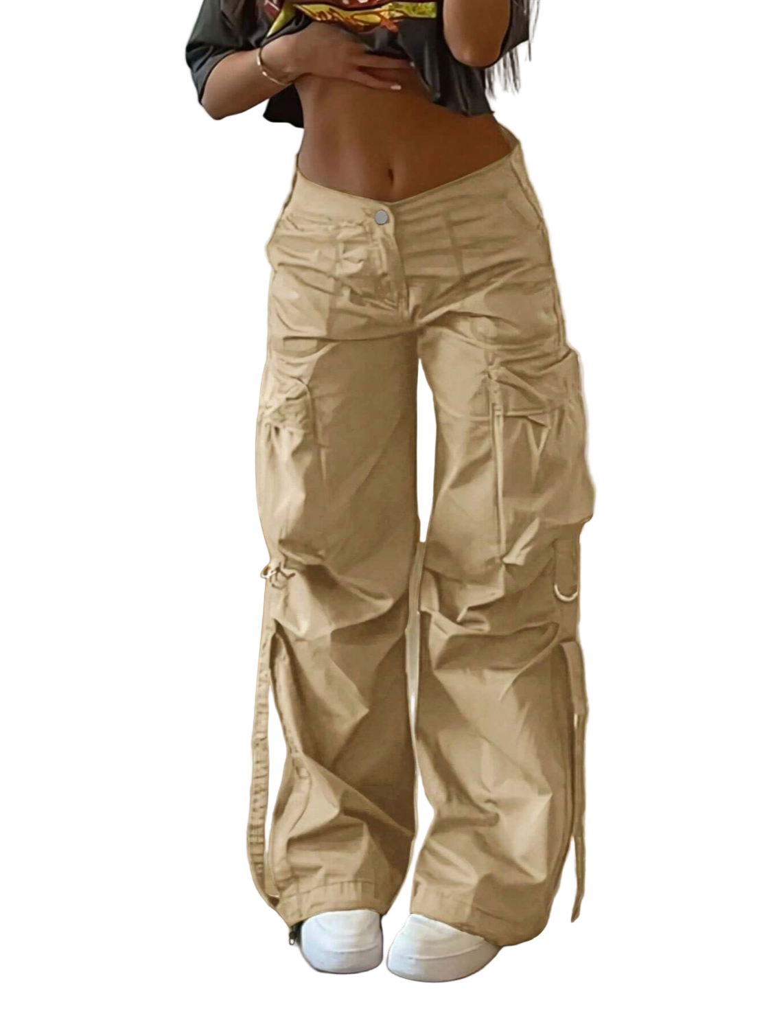 Person wearing beige cargo pants in a room with a couch and wooden floor.