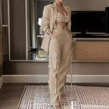 Elegant linen-blend two-piece set with high-waisted cargo pants and a modern blazer, perfect for day and night fashion.