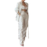 Woman wearing Power Linen Set with high-waisted cargo pants and blazer, showcasing sleek and chic style for day or night wear.