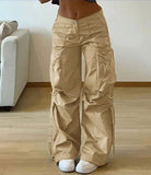 Beige Gravity Parachute Pants with cargo pockets and adjustable toggles, perfect for a bold streetwear look for fashion-forward girls.