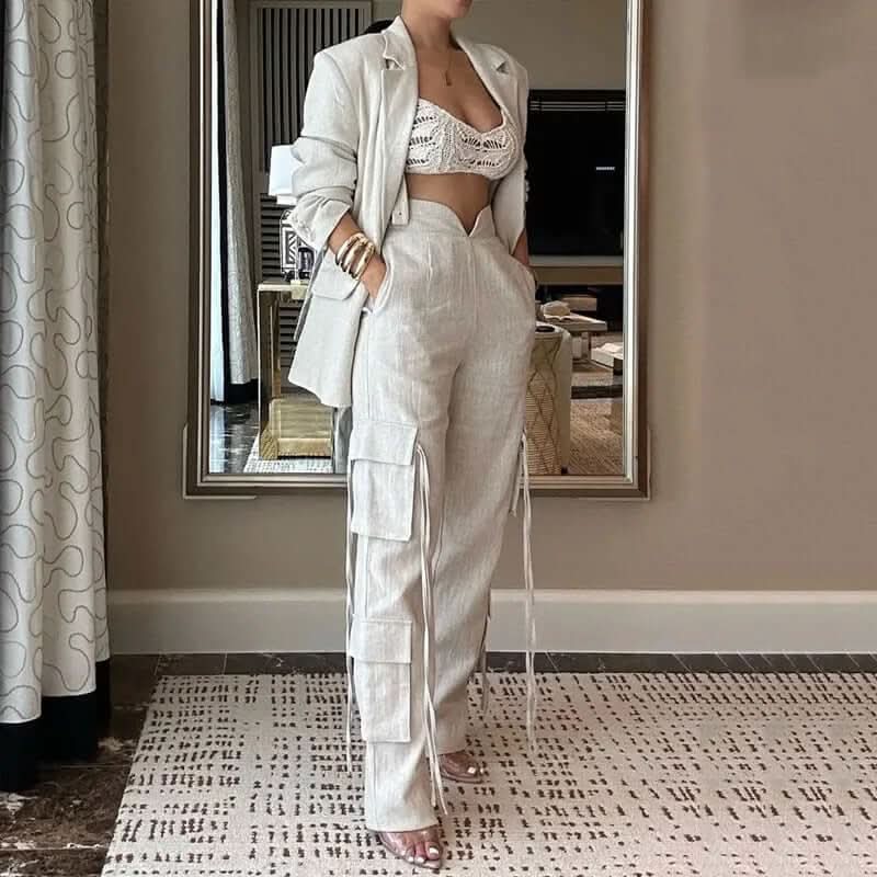 Woman wearing power linen set with high-waisted cargo pants and matching blazer, chic and elegant for day or night.