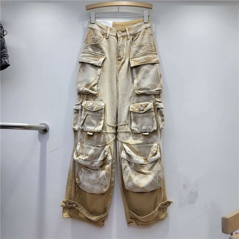 Desert Storm Cargo Pants with multi-pocket design in washed vintage finish hanging on a rack, ideal for edgy streetwear fashion.