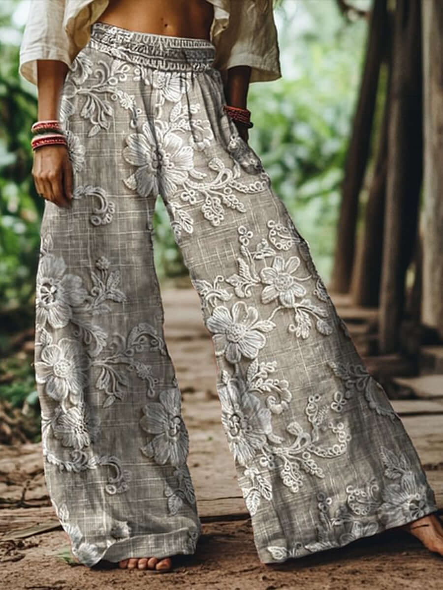 Boho Bloom Pants with floral embroidery and wide-leg fit, perfect for summer and bohemian style outfits.