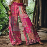 Woman wearing Boho Bloom Pants with floral embroidery and wide-leg fit, ideal for bohemian style, summer outings, and sunset markets.