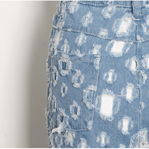 Street trendy ripped hole raw edge jeans.