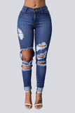 High Waist Jeans with Ripped Hips - The Woman Concept