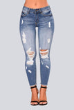 High Waist Jeans with Ripped Hips - The Woman Concept