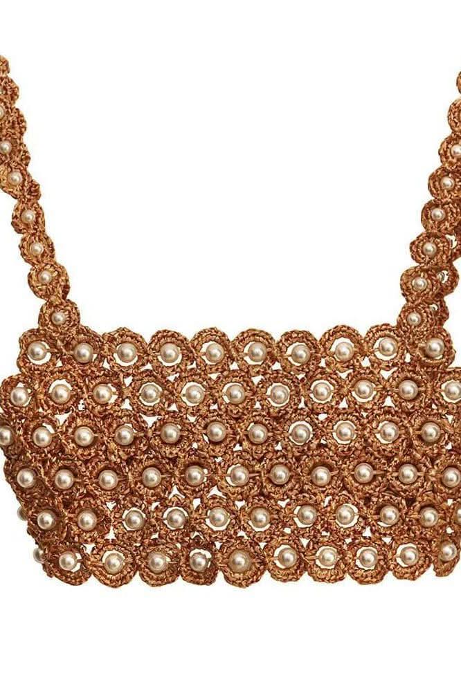 Hand-crocheted sleeveless beaded slim top.