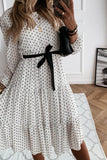 Midi White dress with polka dots.