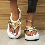 Thick-soled chain sandals.